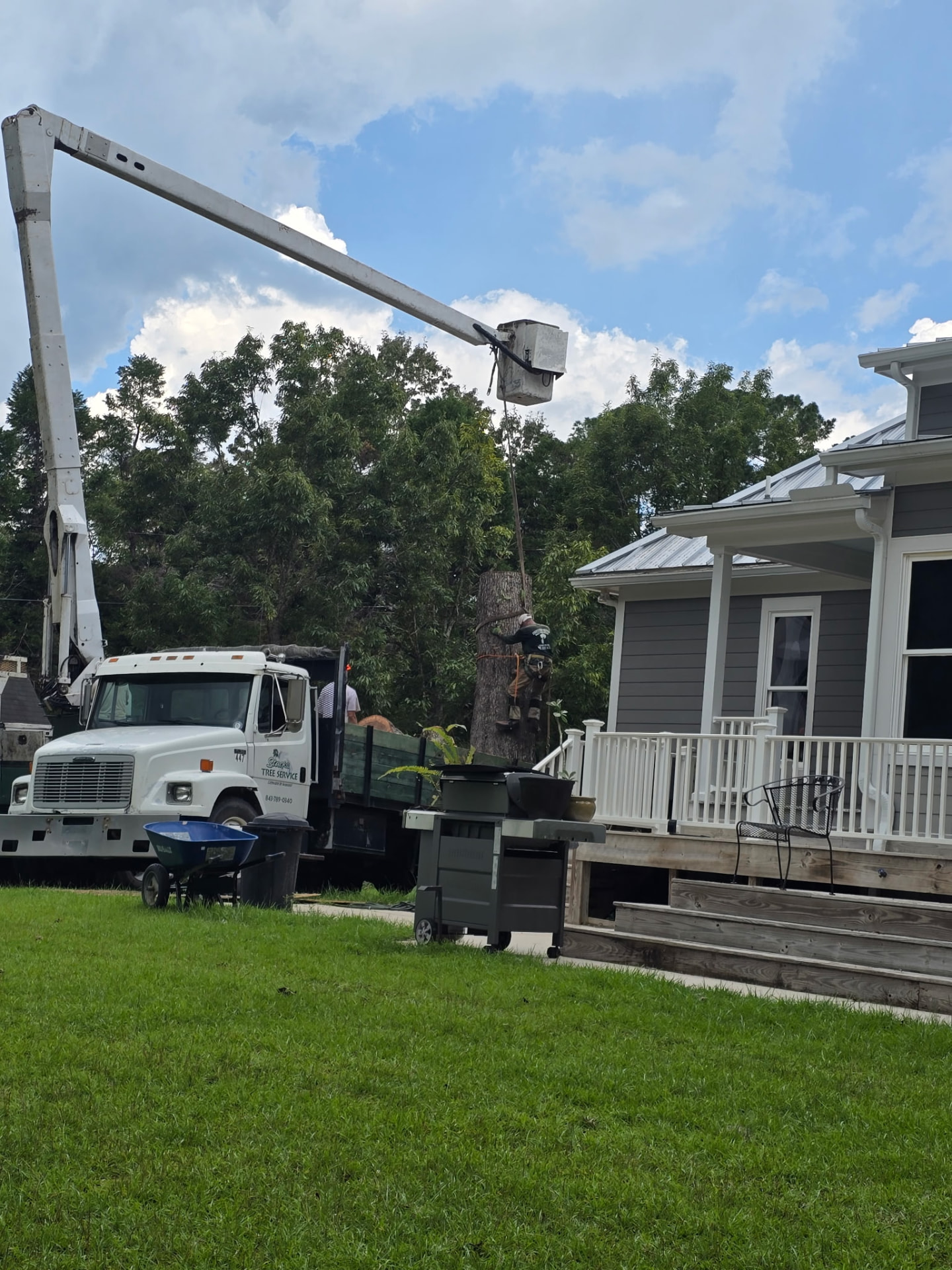 Bucket-truck removal beside a home — Stacks Tree Service, Summerville SC